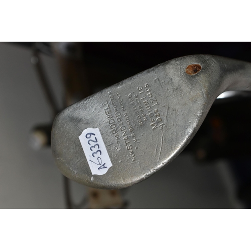 348 - A GROUP OF VINTAGE GOLF CLUBS AND TROLLEY, comprising a leather trimmed canvas golf bag, a hickory s... 