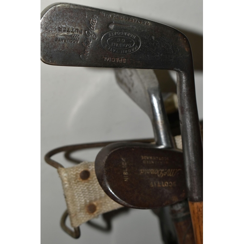 348 - A GROUP OF VINTAGE GOLF CLUBS AND TROLLEY, comprising a leather trimmed canvas golf bag, a hickory s... 