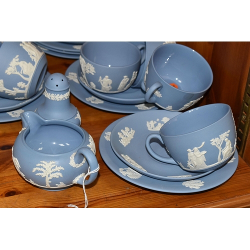 352 - A WEDGWOOD BLUE JASPERWARE TEA SET, comprising a teapot, covered sugar bowl, milk jug, sugar sifter ... 