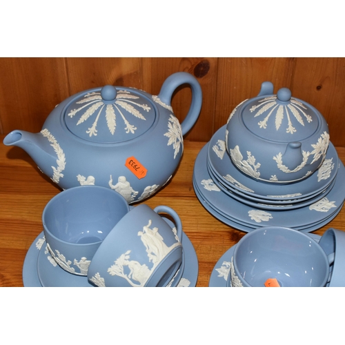 352 - A WEDGWOOD BLUE JASPERWARE TEA SET, comprising a teapot, covered sugar bowl, milk jug, sugar sifter ... 