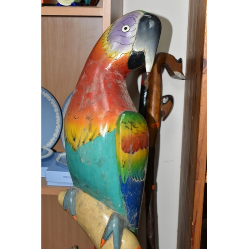 356 - A LARGE FLOOR PAINTED CARVED WOOD PARROT, floor standing, height 100cm and two carved wood walking s... 