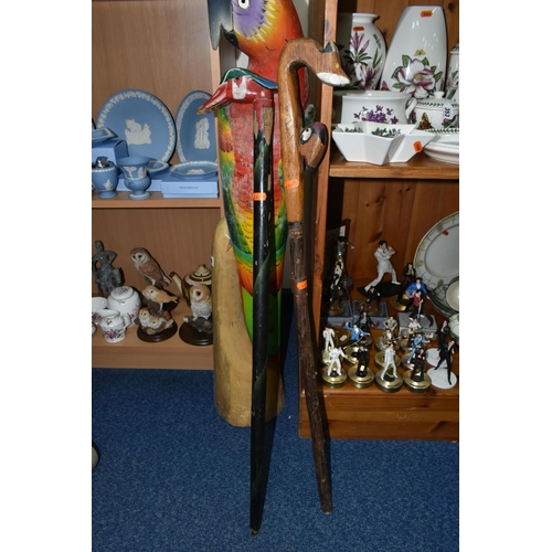 356 - A LARGE FLOOR PAINTED CARVED WOOD PARROT, floor standing, height 100cm and two carved wood walking s... 