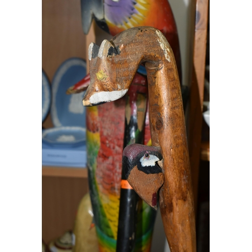 356 - A LARGE FLOOR PAINTED CARVED WOOD PARROT, floor standing, height 100cm and two carved wood walking s... 