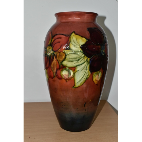 357 - A MOORCROFT POTTERY FLAMBÉ 'CLEMATIS' PATTERN VASE, of ovoid form, tube lined with red and purple cl... 