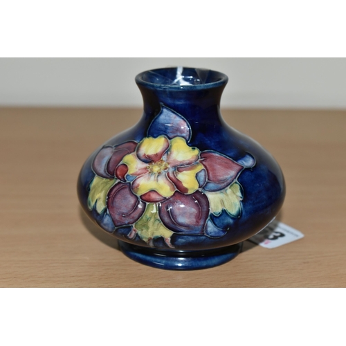 363 - A MOORCROFT POTTERY 'COLUMBINE' PATTERN VASE, of squat form, tube lined with yellow, pink and purple... 