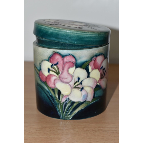 367 - A MOORCROFT POTTERY 'FREESIA' PATTERN COVERED JAR, of cylindrical form, tube lined with pale yellow ... 