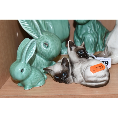 379 - A GROUP OF ANIMAL THEMED CERAMICS, comprising a Beswick lying down Siamese cat no 1558, Beswick Siam... 