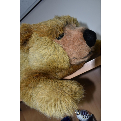 380 - A STEIFF URS BROWN BEAR, No.069673, soft plush brown bear in a lying position, button and tag to lef... 