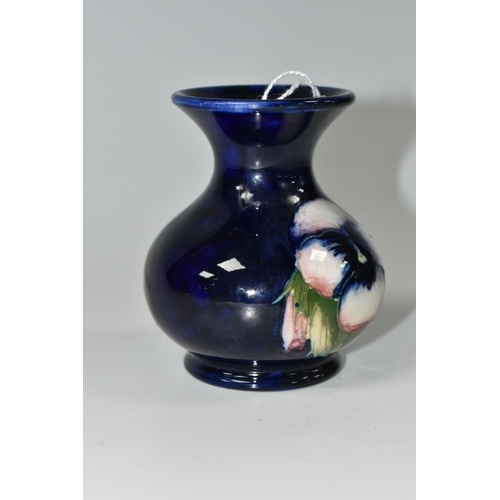 386 - A MOORCROFT POTTERY SMALL 'PANSY' PATTERN VASE, with flared neck, tube lined with purple pansies on ... 