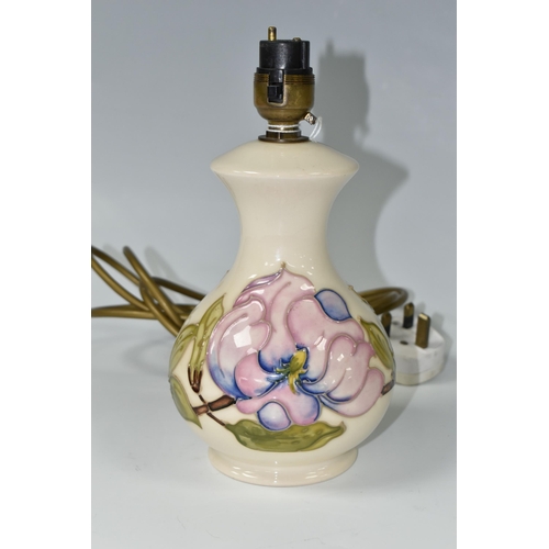 389 - A MOORCROFT POTTERY MAGNOLIA TABLE LAMP BASE, tube lined in pink Magnolia pattern on a cream ground,... 