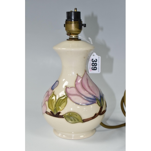 389 - A MOORCROFT POTTERY MAGNOLIA TABLE LAMP BASE, tube lined in pink Magnolia pattern on a cream ground,... 