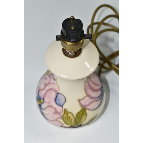 389 - A MOORCROFT POTTERY MAGNOLIA TABLE LAMP BASE, tube lined in pink Magnolia pattern on a cream ground,... 