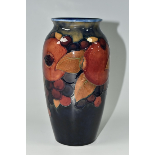 391 - A MOORCROFT POTTERY 'POMEGRANATE' PATTERN VASE, of ovoid form, tube lined with pomegranates, berries... 