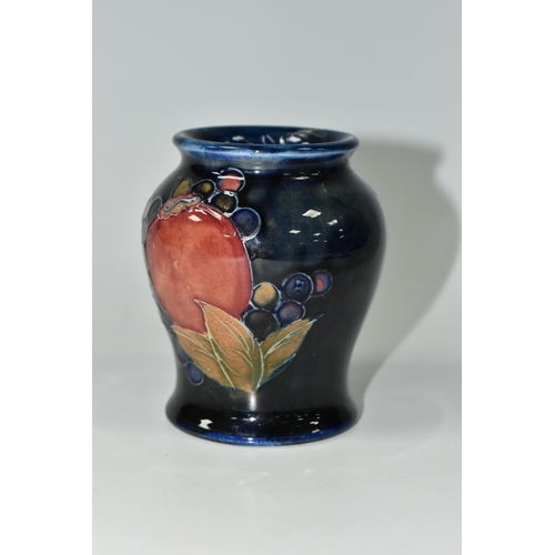 392 - A MOORCROFT POTTERY 'POMEGRANATE' PATTERN VASE, of small baluster form, tube lined with pomegranates... 