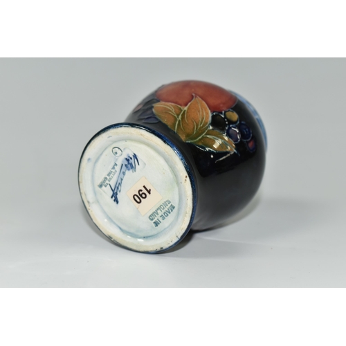 392 - A MOORCROFT POTTERY 'POMEGRANATE' PATTERN VASE, of small baluster form, tube lined with pomegranates... 