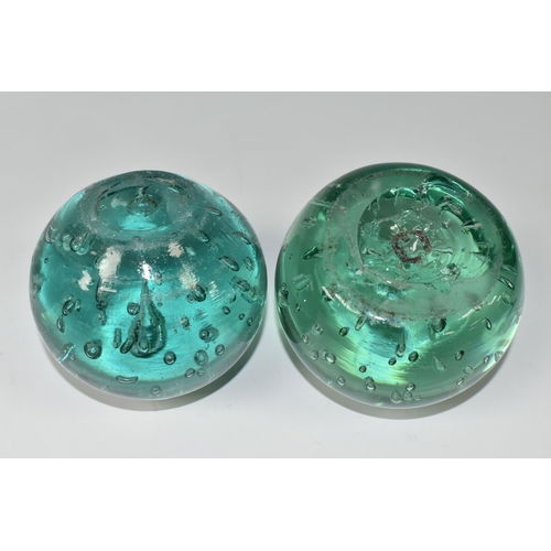 395 - TWO VICTORIAN GREEN AND AQUA GLASS DUMP WEIGHTS, with controlled bubbles, rough pontil marks, approx... 