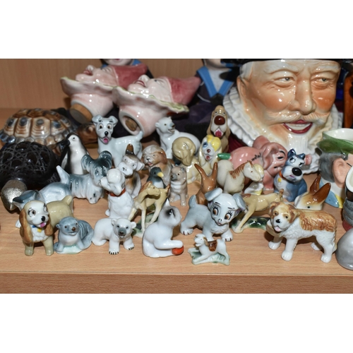 399 - A GROUP OF CHARACTER JUGS, SAILOR DOLLS AND ANIMAL FIGURES, to include two Nora Wellings style souve... 