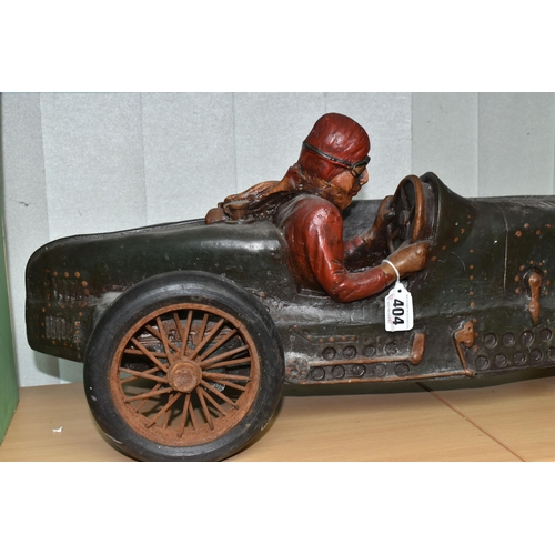 404 - A COMPOSITE MODEL OF A RACING CAR AND DRIVER, with turning wheels, length approximately 70cm x heigh... 