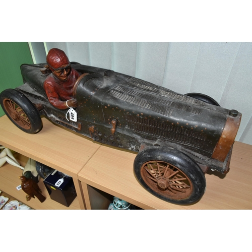 404 - A COMPOSITE MODEL OF A RACING CAR AND DRIVER, with turning wheels, length approximately 70cm x heigh... 