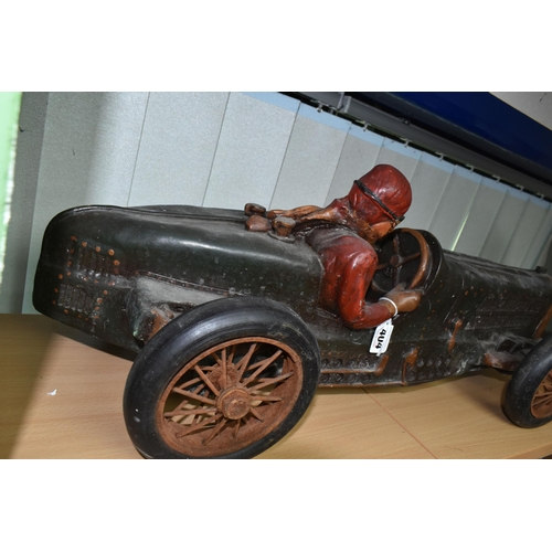 404 - A COMPOSITE MODEL OF A RACING CAR AND DRIVER, with turning wheels, length approximately 70cm x heigh... 