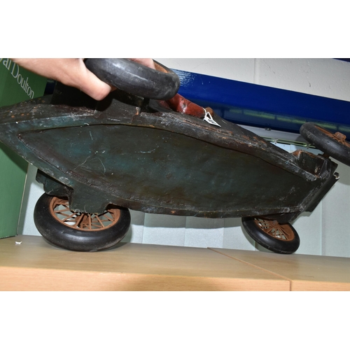 404 - A COMPOSITE MODEL OF A RACING CAR AND DRIVER, with turning wheels, length approximately 70cm x heigh... 