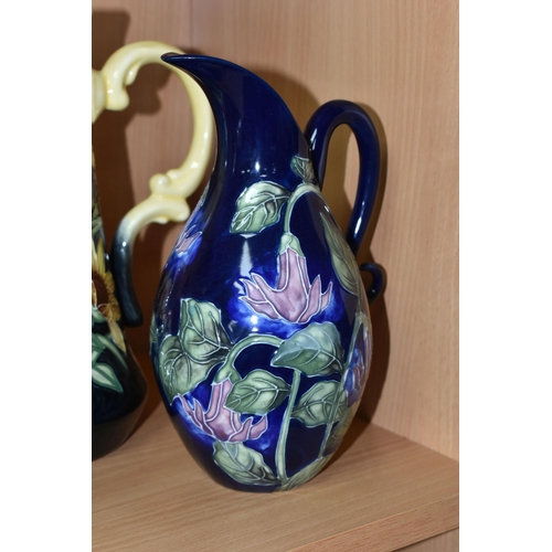 405 - FOUR PIECES OF OLD TUPTON WARE, comprising a jug and a vase in Summer Bouquet pattern, a squat vase ... 