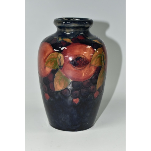 409 - A MOORCROFT POTTERY 'POMEGRANATE' PATTERN VASE, of ovoid form, tube lined with pomegranates, berries... 