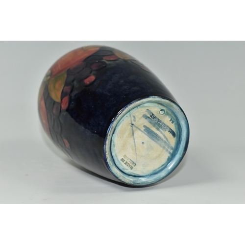 409 - A MOORCROFT POTTERY 'POMEGRANATE' PATTERN VASE, of ovoid form, tube lined with pomegranates, berries... 