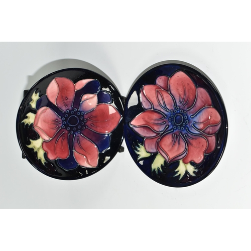 415 - TWO MOORCROFT POTTERY 'ANEMONE' PATTERN TRINKET DISHES, each tube lined with pink and purple anemone... 