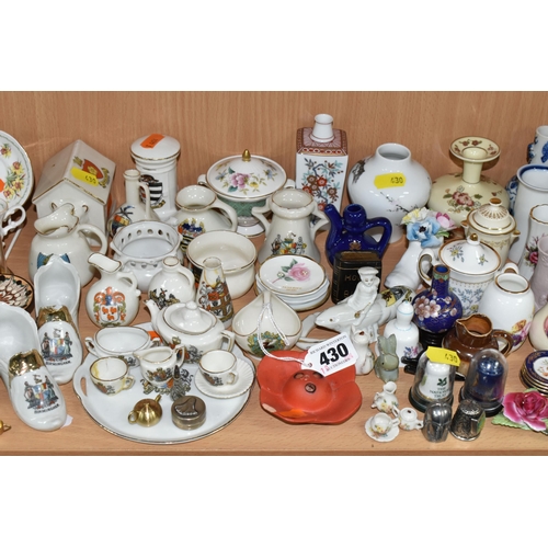 430 - A QUANTITY OF NAMED CERAMICS, comprising six porcelain pin cushion doll tops, a quantity of miniatur... 