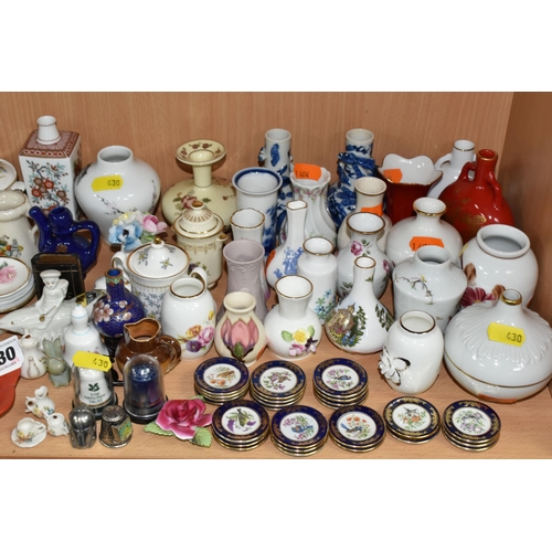 430 - A QUANTITY OF NAMED CERAMICS, comprising six porcelain pin cushion doll tops, a quantity of miniatur... 