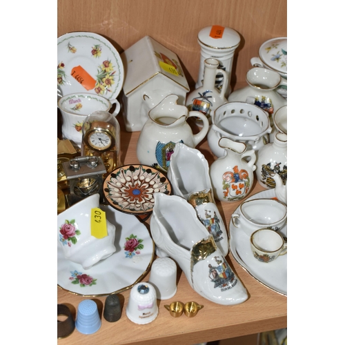 430 - A QUANTITY OF NAMED CERAMICS, comprising six porcelain pin cushion doll tops, a quantity of miniatur... 