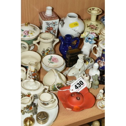 430 - A QUANTITY OF NAMED CERAMICS, comprising six porcelain pin cushion doll tops, a quantity of miniatur... 