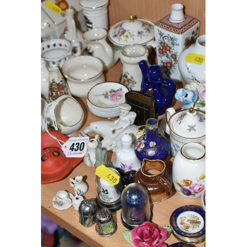 430 - A QUANTITY OF NAMED CERAMICS, comprising six porcelain pin cushion doll tops, a quantity of miniatur... 