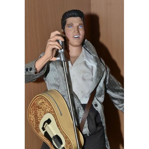 435 - A BOXED TELEMANIA ELVIS TELEPHONE, comprising a singing and dancing telephone DM-221-002 with instru... 