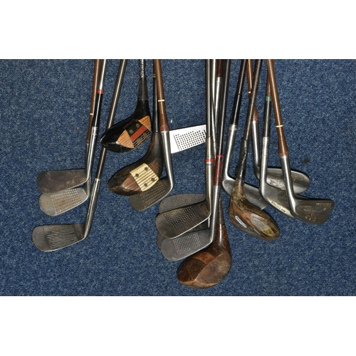 444 - A COLLECTION OF SEVENTEEN VINTAGE GOLF CLUBS, to include woods and drivers etc.