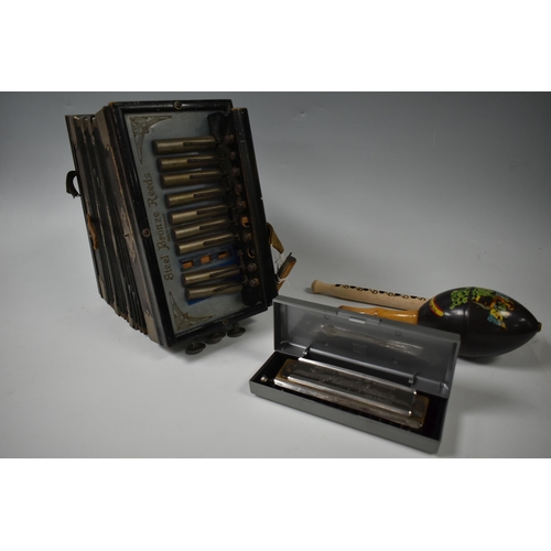 485 - ONE BOX OF MIUSICAL INSTRUMENTS, to include a Larry Adler Professional 12 chromatic harmonica, a 192... 