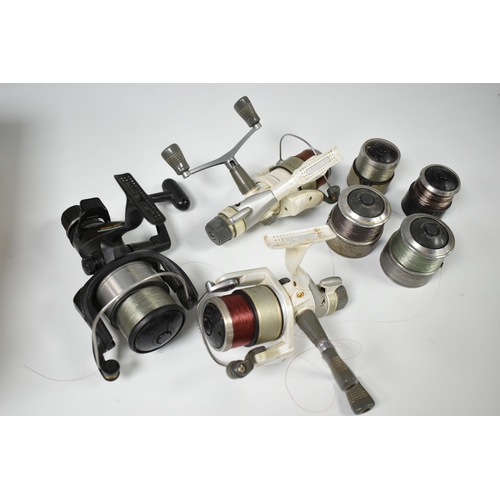 493 - THREE SHIMANO FISHING REELS, comprising two Stradic 4000M reels with fighting drag system, two spare... 