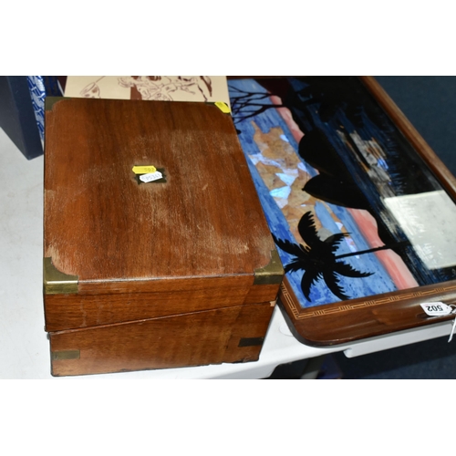 502 - A BRAZILIAN INLAID MAHOGANY BUTTERFLY WING TEA TRAY, decorated with geometrically reserved silhouett... 