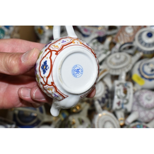 518 - TWO BOXES OF 'PORCELAIN ART' MINIATURE TEAPOT COLLECTION, approximately ninety-four in total, variou... 