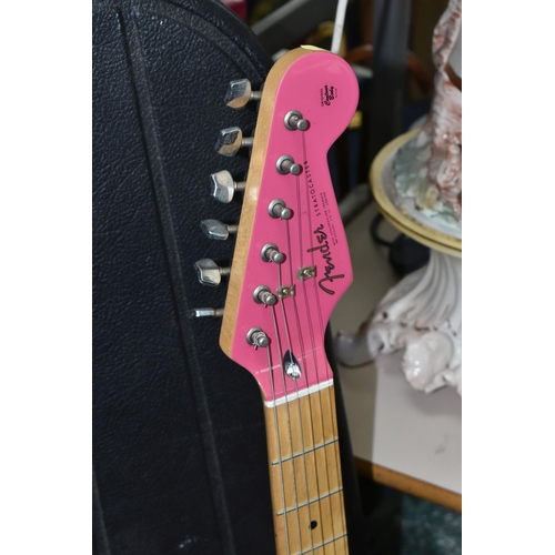 540 - AN ELECTRIC STRATOCASTER TYPE GUITAR IN PINK AND WHITE with faux Fender decals, no serial number or ... 