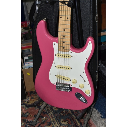 540 - AN ELECTRIC STRATOCASTER TYPE GUITAR IN PINK AND WHITE with faux Fender decals, no serial number or ... 