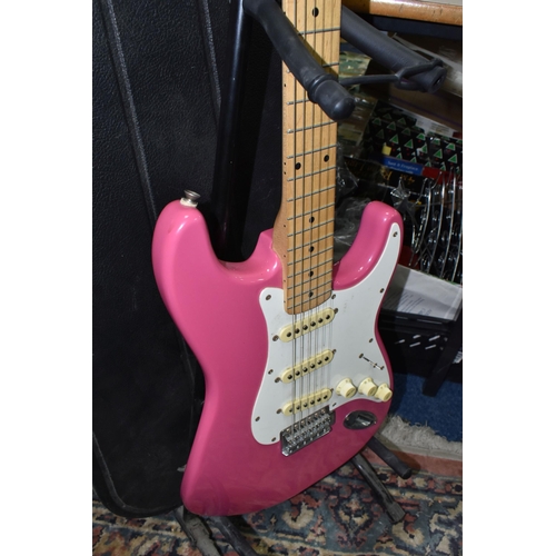 540 - AN ELECTRIC STRATOCASTER TYPE GUITAR IN PINK AND WHITE with faux Fender decals, no serial number or ... 