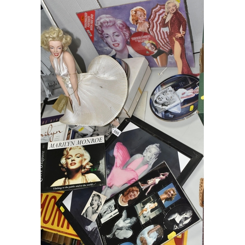 555 - A COLLECTION OF MODERN MARILYN MONROE MEMORABILIA, including six collectors plates, two boxed, a str... 