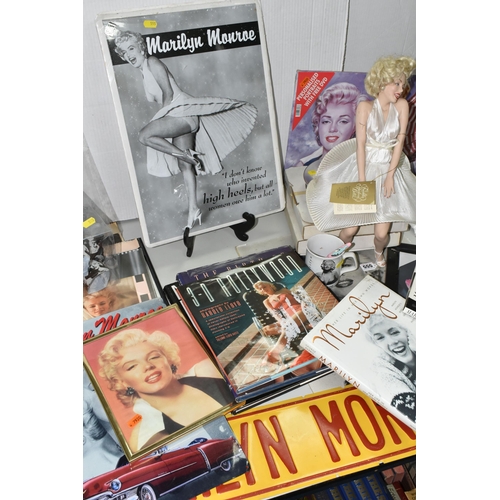 555 - A COLLECTION OF MODERN MARILYN MONROE MEMORABILIA, including six collectors plates, two boxed, a str... 