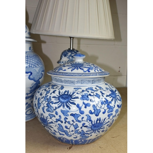 563 - A GROUP OF BLUE AND WHITE CERAMICS, to include a pair of modern table lamps by Elstead Lighting Co, ... 