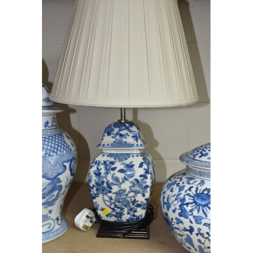 563 - A GROUP OF BLUE AND WHITE CERAMICS, to include a pair of modern table lamps by Elstead Lighting Co, ... 