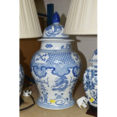 563 - A GROUP OF BLUE AND WHITE CERAMICS, to include a pair of modern table lamps by Elstead Lighting Co, ... 