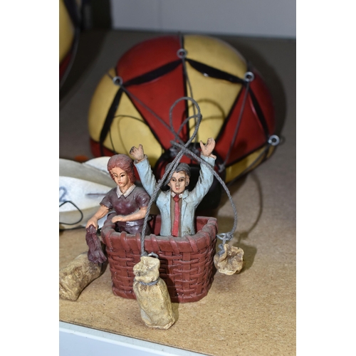 565 - THREE MODERN HOT AIR BALLOON/AIRSHIP HANGING ORNAMENTS, comprising two resin balloons with hanging b... 