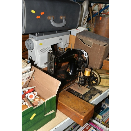 566 - TWO BOXES AND LOOSE SEWING MACHINES, HABERDASHERY, TEXTILES AND NEEDLEWORK EQUIPMENT, to include a s... 